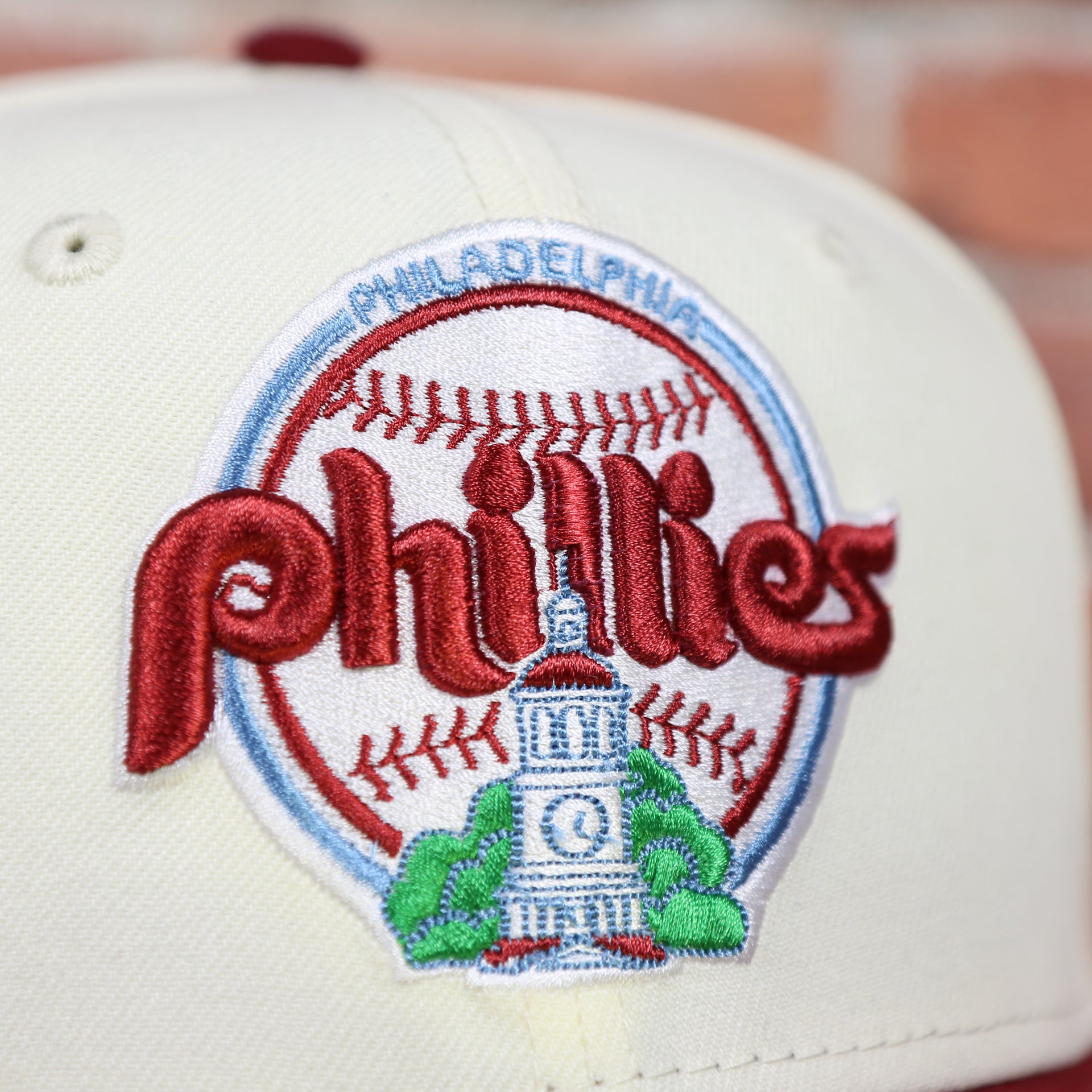 Close up of the Phillies logo on the Philadelphia Phillies Cooperstown City Hall Logo Veterans Stadium Side Patch Powder Blue UV 59Fifty Fitted Cap | Chrome/Maroon nohiosafariclub Exclusive