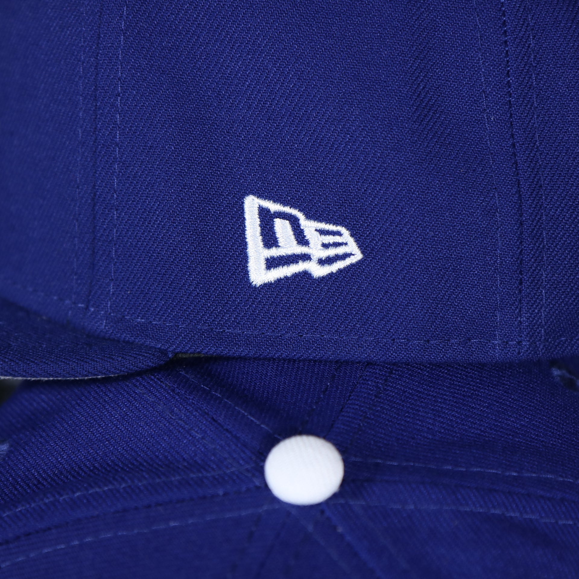 new era log on the wearers left side of the Brooklyn Dodgers Cooperstown Royal Blue 9Fifty Snapback Cap | OSFM
