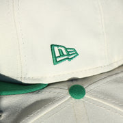 Close up of the New Era logo on the wearer's left of the Philadelphia Eagles Throwback Wordmark Jersey Script Cream/Kelly Green Black UV Side Patch 59Fifty Fitted Cap | Cap Swag Exclusive