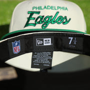 Labels on the interior of the Philadelphia Eagles Throwback Wordmark Jersey Script Cream/Kelly Green Black UV Side Patch 59Fifty Fitted Cap | nohiosafariclub Exclusive