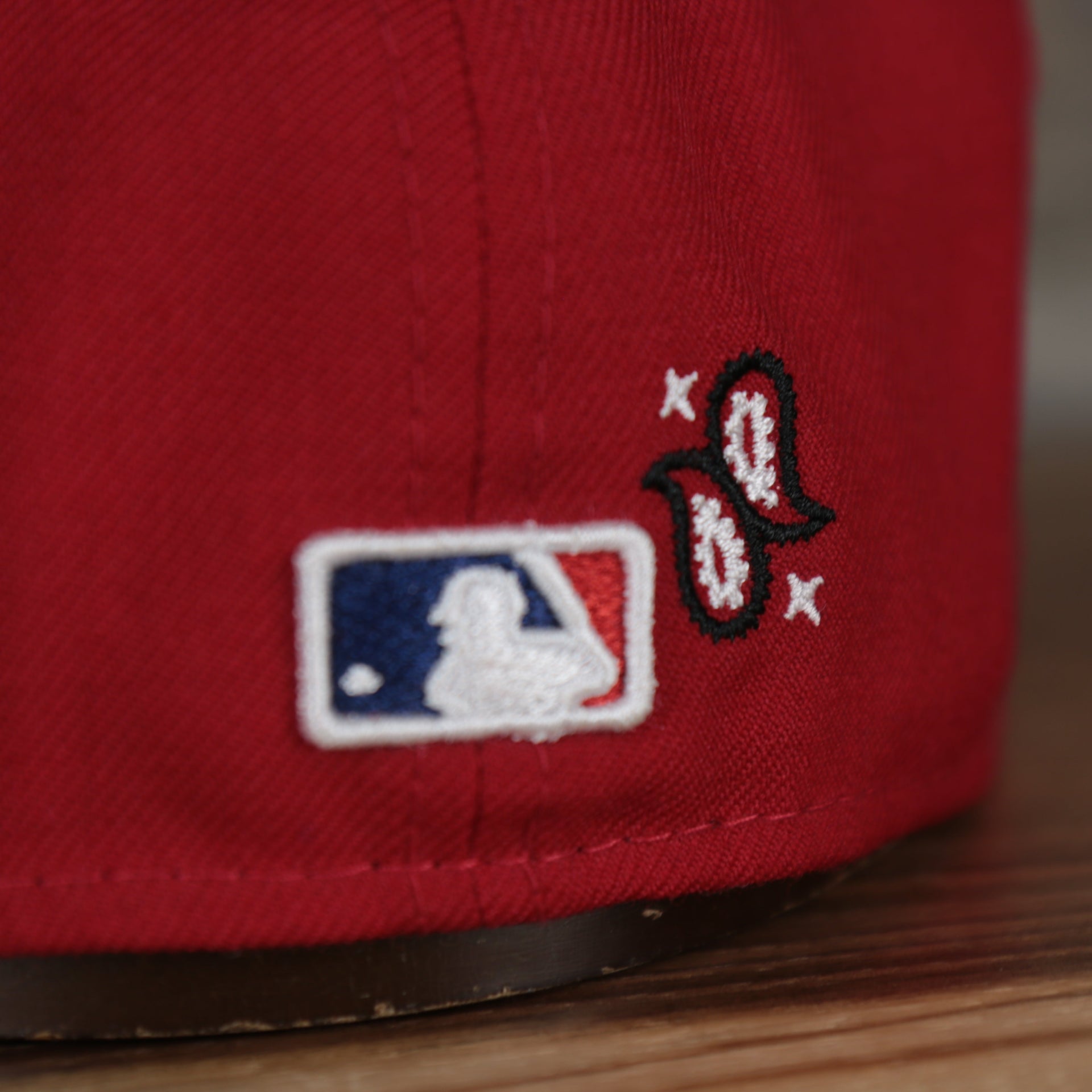 mlb logo on the Philadelphia Phillies All Over Paisley Bandana Pattern Grey Bottom Red 5950 Fitted Cap | Bandana Paisley