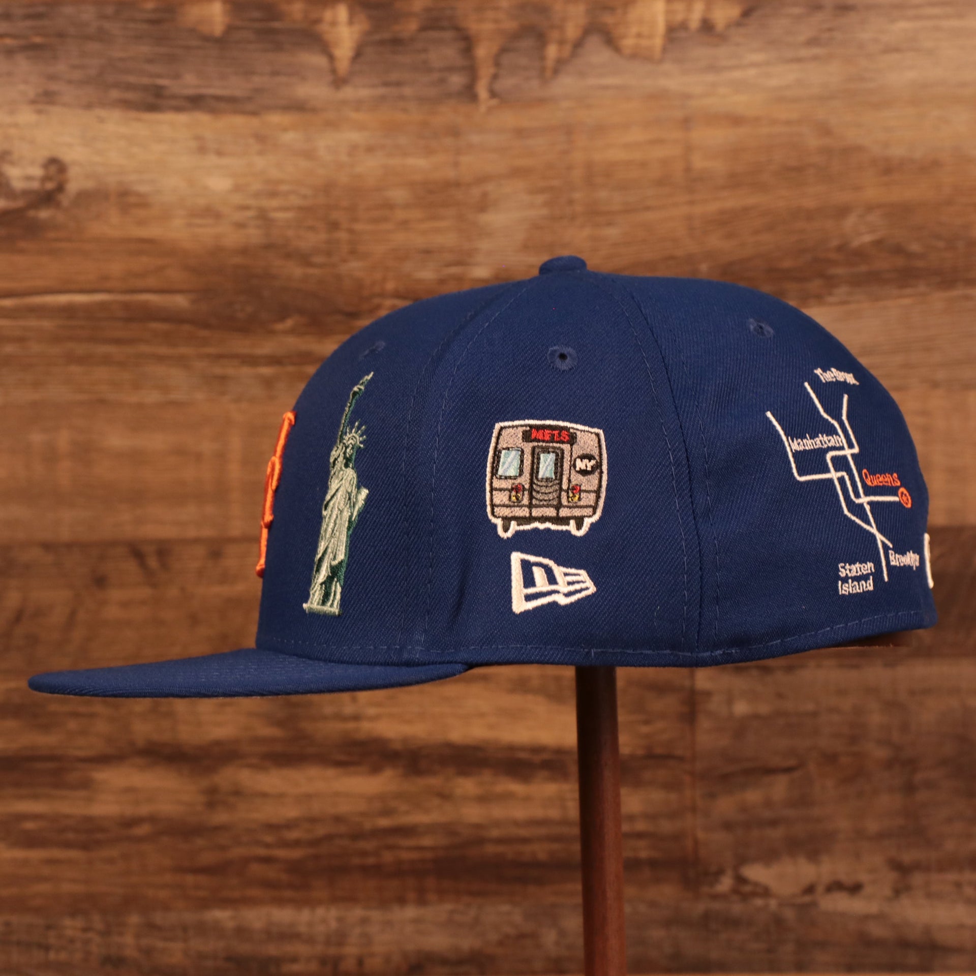 Wearer's left of the New York Mets City Transit All Over Side Patch Gray Bottom 59Fifty Fitted Cap