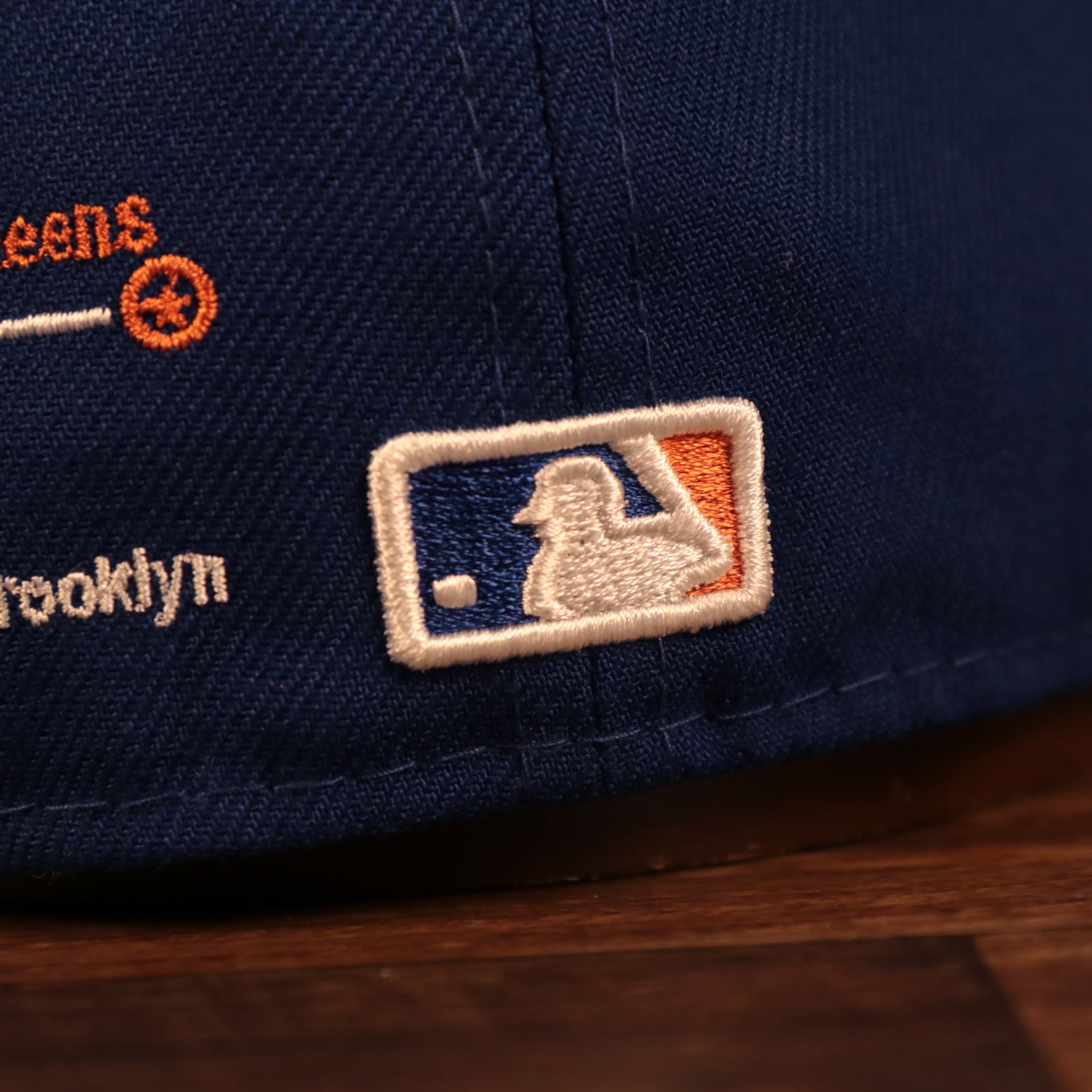 Close up of the MLB batterman logo of the New York Mets City Transit All Over Side Patch Gray Bottom 59Fifty Fitted Cap