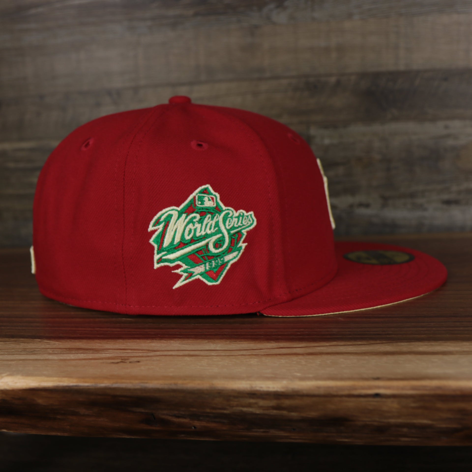 wearers right side on the New York Yankees 1999 World Series Side Patch Yellow Bottom 59Fifty Fitted Cap | Red | State Fruit
