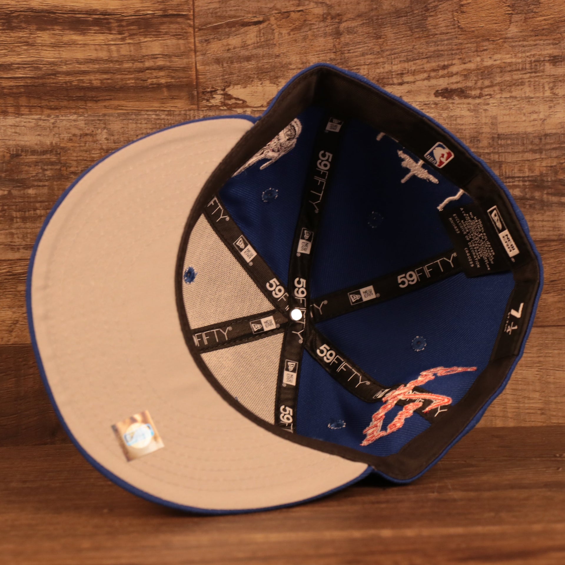 Gray bottom of the Philadelphia 76ers City Transit All Over Side Patch Gray Bottom 59Fifty Fitted Cap