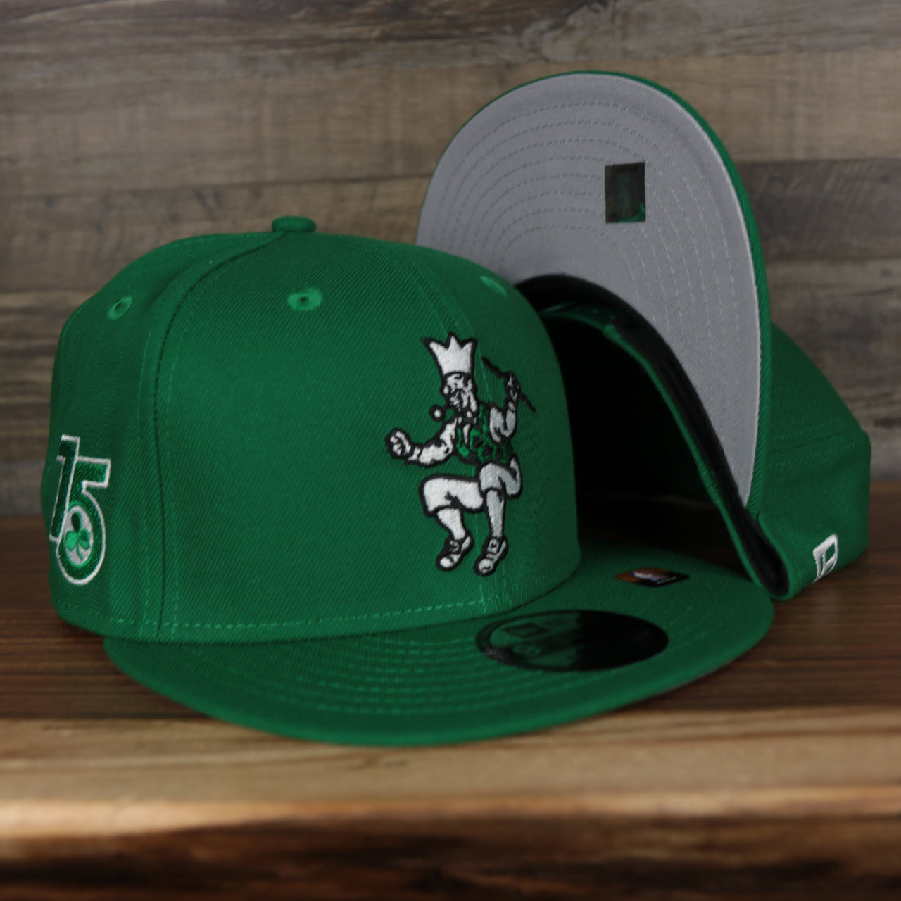 front and bottom of the Boston Celtics 2021 City Edition Vintage Grey Bottom 9Fifty Snapback | Green