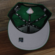 underside of the Boston Celtics 2021 City Edition Vintage Grey Bottom 9Fifty Snapback | Green