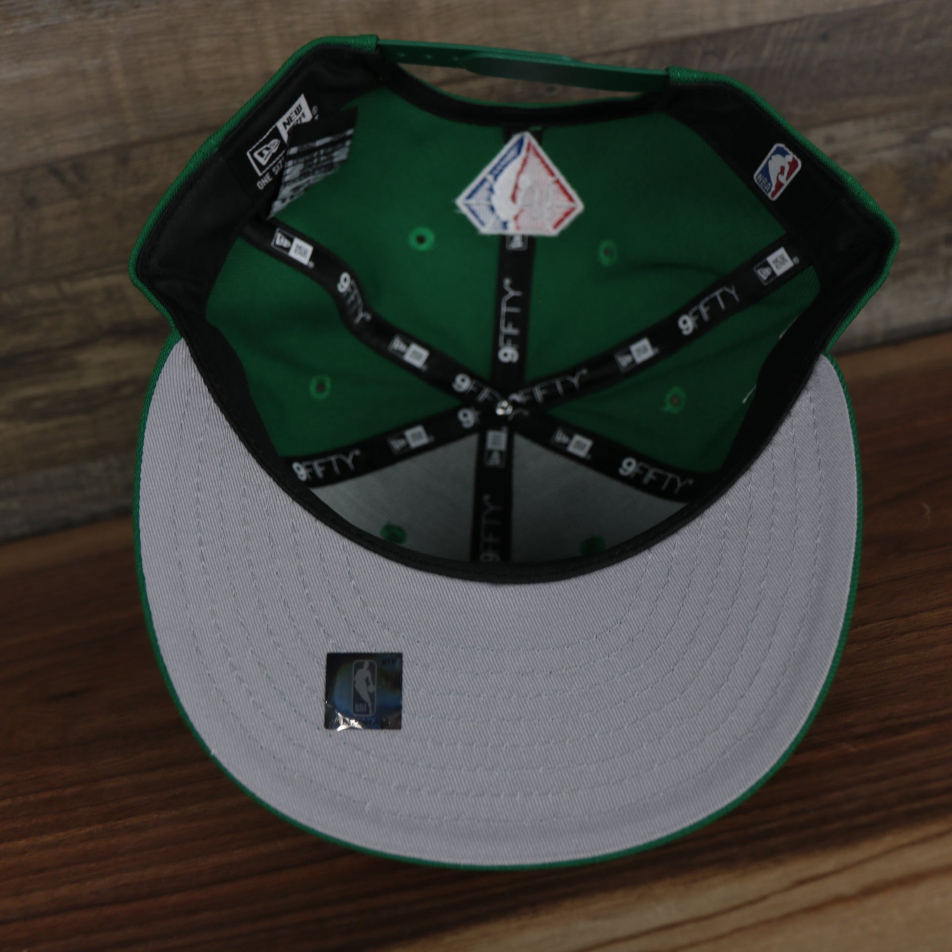 underside of the Boston Celtics 2021 City Edition Vintage Grey Bottom 9Fifty Snapback | Green