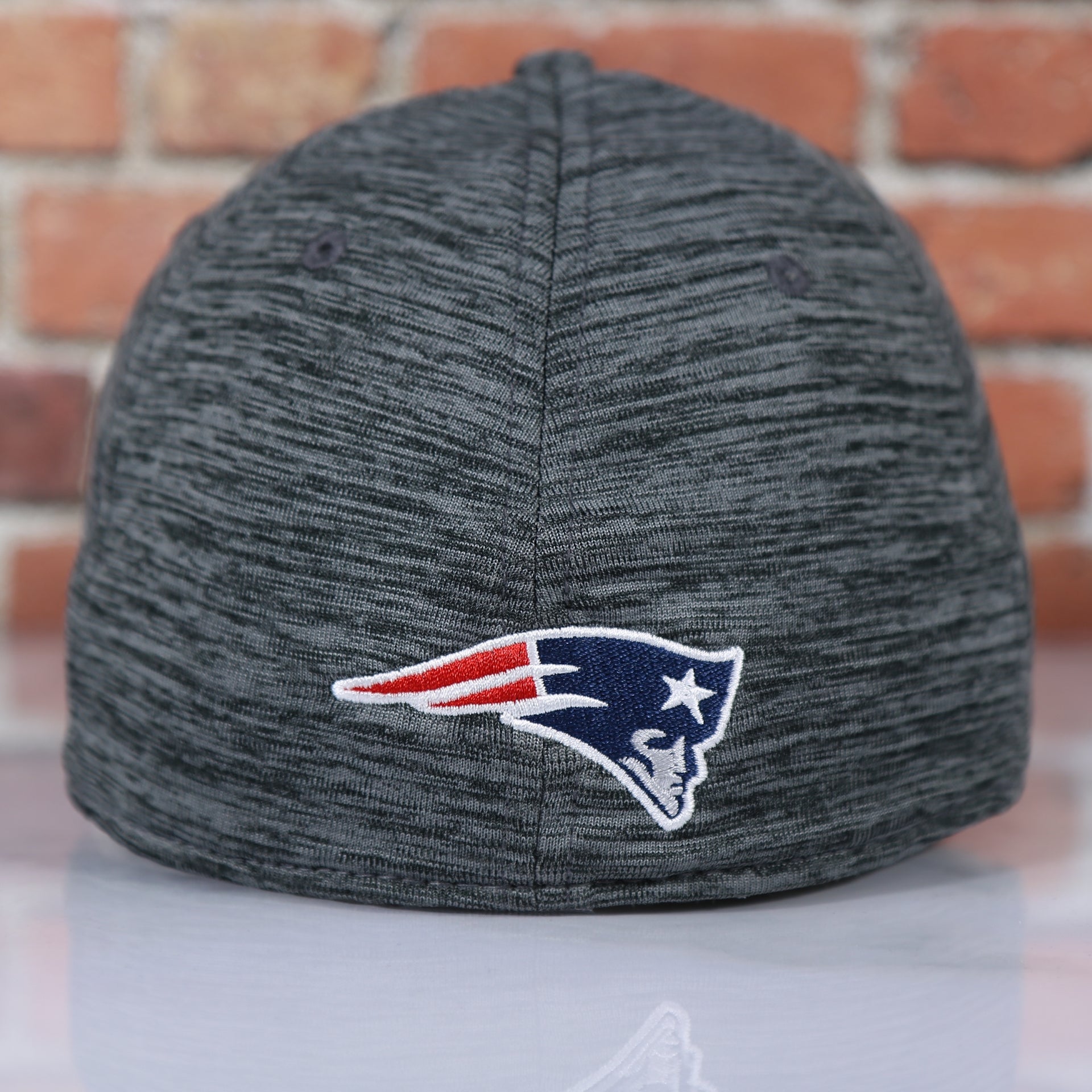 patriots logo on the Patriots 2020 Training Camp Flexfit | New England Patriots 2020 On-Field Grey Training Camp Stretch Fit