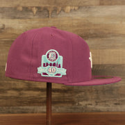 Wearer's right of the Philadelphia Athletics Glow In The Dark Oakland 40 Year Patch Teal Bottom Side Patch 59Fifty Fitted Cap