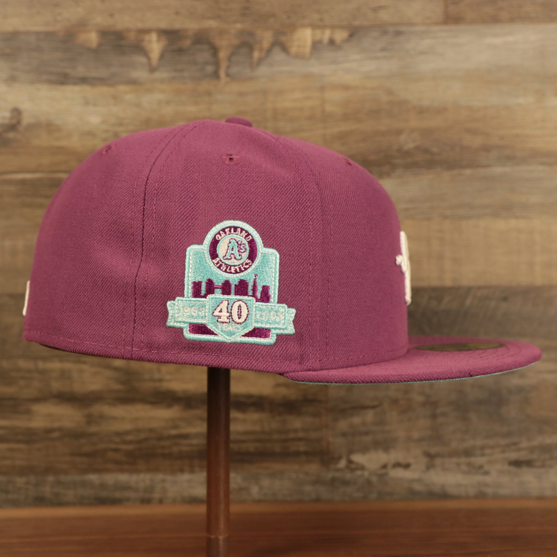Wearer's right of the Philadelphia Athletics Glow In The Dark Oakland 40 Year Patch Teal Bottom Side Patch 59Fifty Fitted Cap