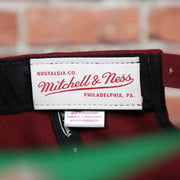 mitchell and ness label on the Cleveland Cavaliers Classic Maroon Snapback Hat