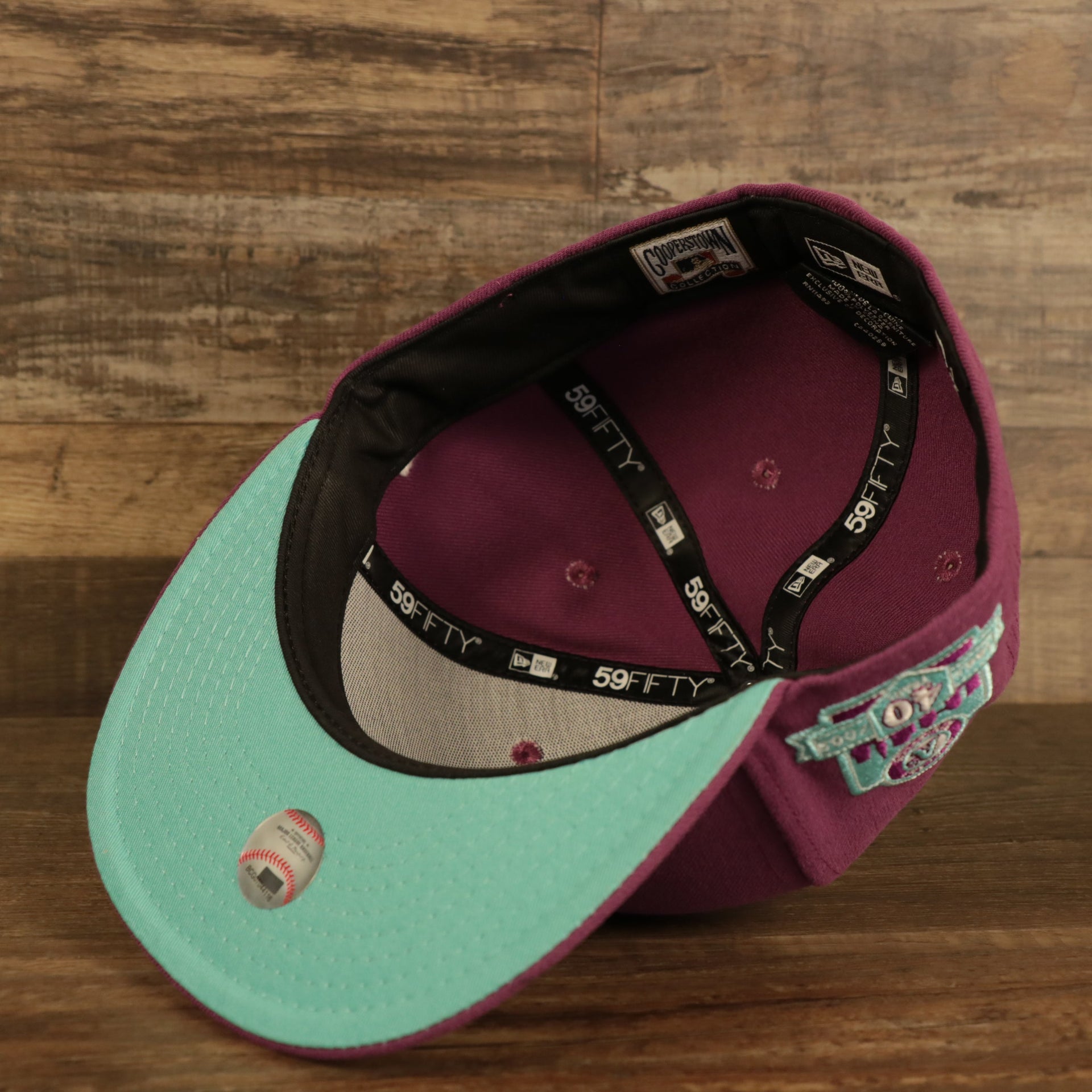 Teal under visor for the Philadelphia Athletics Glow In The Dark Oakland 40 Year Patch Teal Bottom Side Patch 59Fifty Fitted Cap