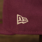 Close up of the New Era logo on the Philadelphia Athletics Glow In The Dark Oakland 40 Year Patch Teal Bottom Side Patch 59Fifty Fitted Cap