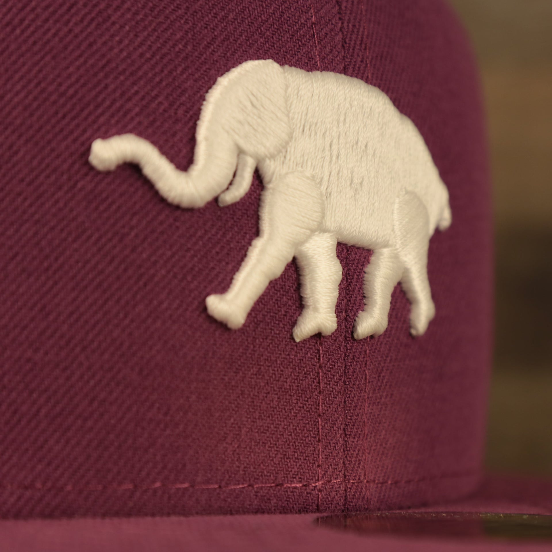 Close up of the vintage Athletics elephant logo on the Philadelphia Athletics Glow In The Dark Oakland 40 Year Patch Teal Bottom Side Patch 59Fifty Fitted Cap