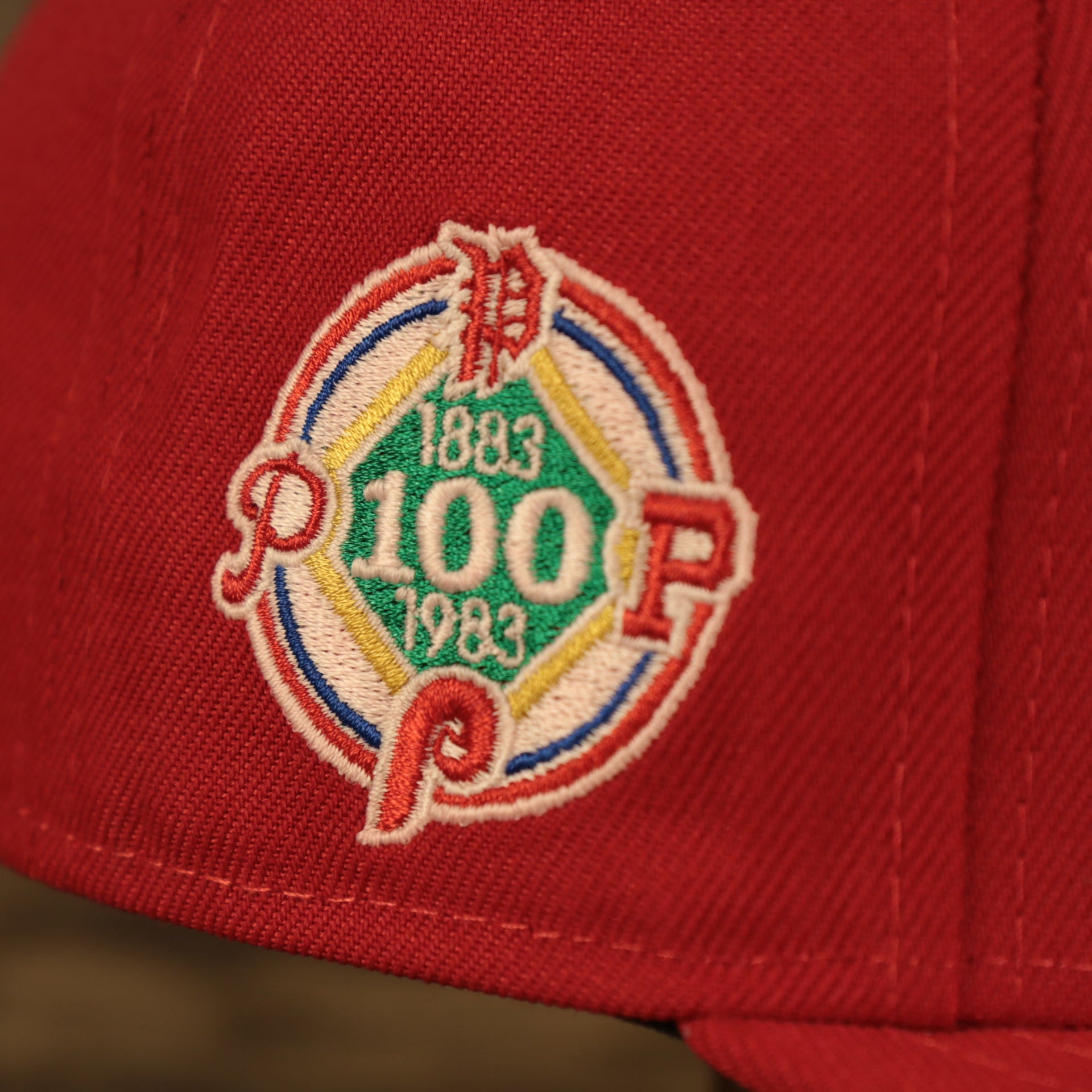 Close up side patch on the Philadelphia Phillies Glow In The Dark 100th Anniversary Teal Bottom Side Patch 59Fifty Fitted Cap