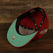 Teal bottom of the Philadelphia Phillies Glow In The Dark 100th Anniversary Teal Bottom Side Patch 59Fifty Fitted Cap