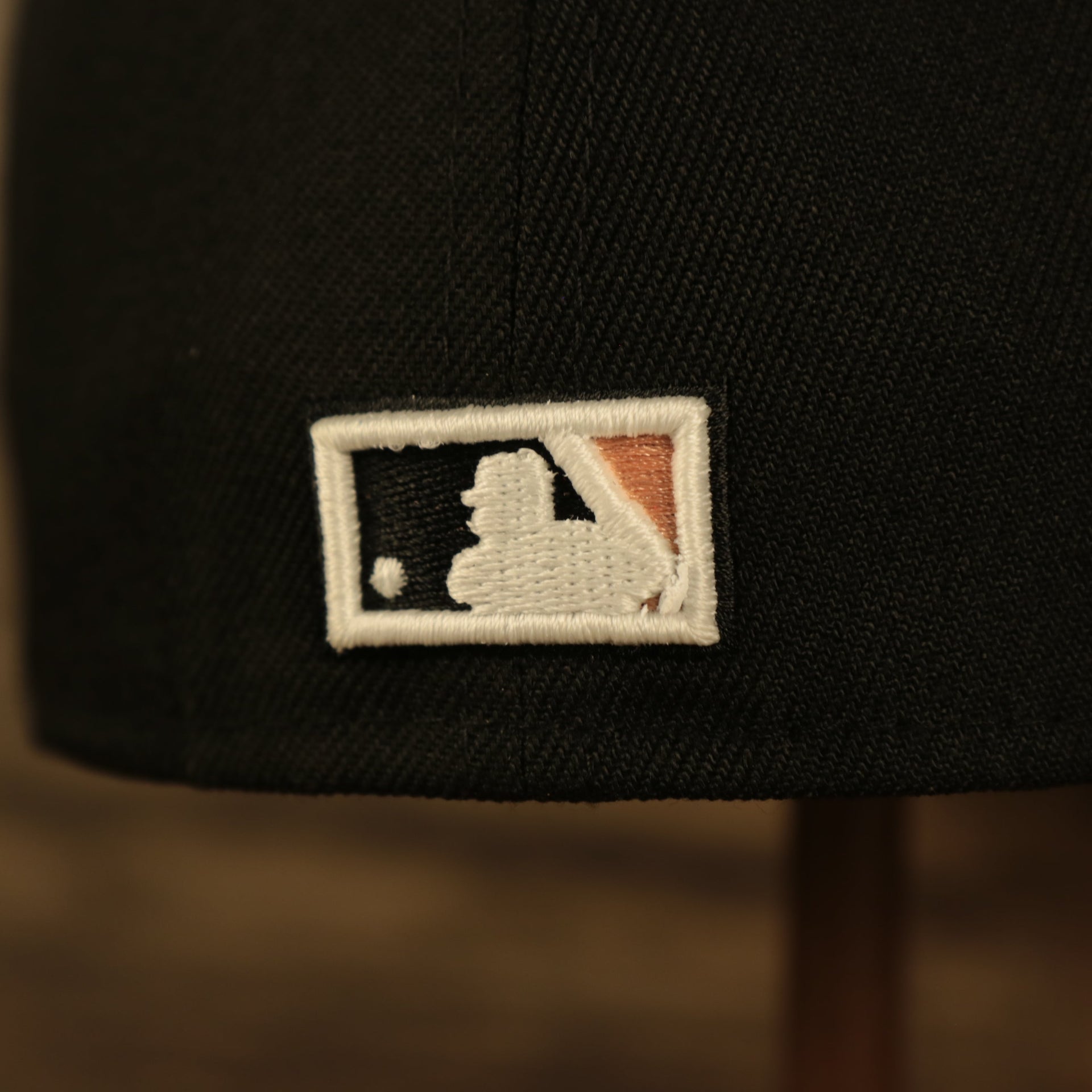 Close up of the MLB Batterman logo on the Atlanta Braves Glow In The Dark 1995 World Series Peach Bottom 59Fifty Side Patch Fitted Cap