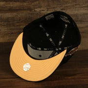 Peach under visor on the Atlanta Braves Glow In The Dark 1995 World Series Peach Bottom 59Fifty Side Patch Fitted Cap