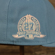 Close up of the 27X World Champions side patch on the New York Yankees Glow In The Dark 27x World Series Champs Patch Pink Bottom Side Patch 59Fifty Fitted Cap