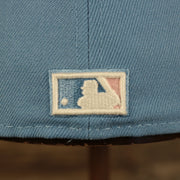 Close up of the MLB Batterman logo on the New York Yankees Glow In The Dark 27x World Series Champs Patch Pink Bottom Side Patch 59Fifty Fitted Cap