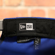 new era label on the Golden State Warriors NBA Draft 9Twenty Dad Hat With Suede Visor | Royal Blue Baseball Hat