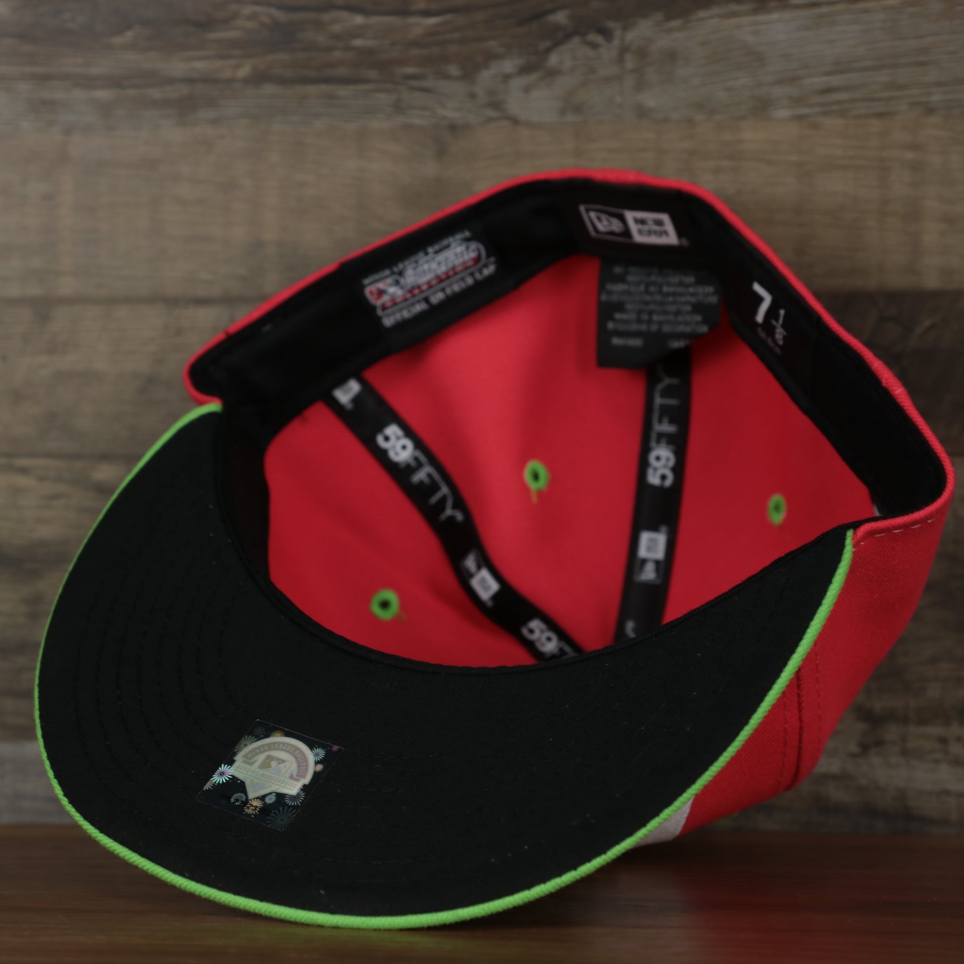 underside of the Harrisburg Senators 2022 Playeros de Harrisburg Copa de la Diversion On-Field Black Bottom 5950 Fitted Cap | Orange