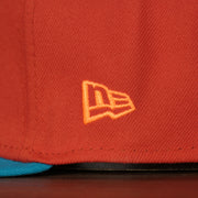 new era logo on the Wisconsin Timber Rattlers 2022 Cascabeles de Wisconsin Copa On-Field Black Bottom 5950 Fitted Cap | Orange