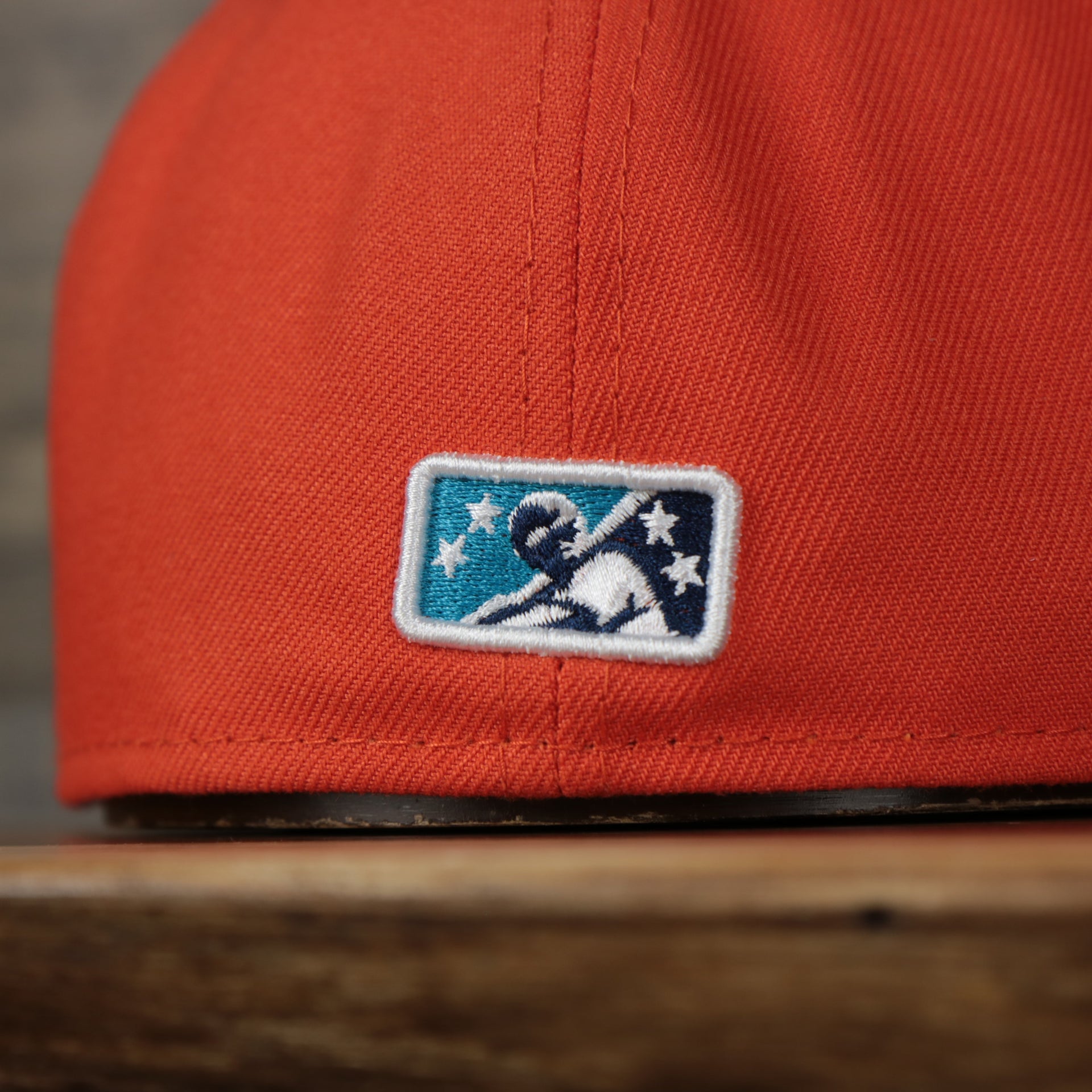 milb logo Wisconsin Timber Rattlers 2022 Cascabeles de Wisconsin Copa On-Field Black Bottom 5950 Fitted Cap | Orange