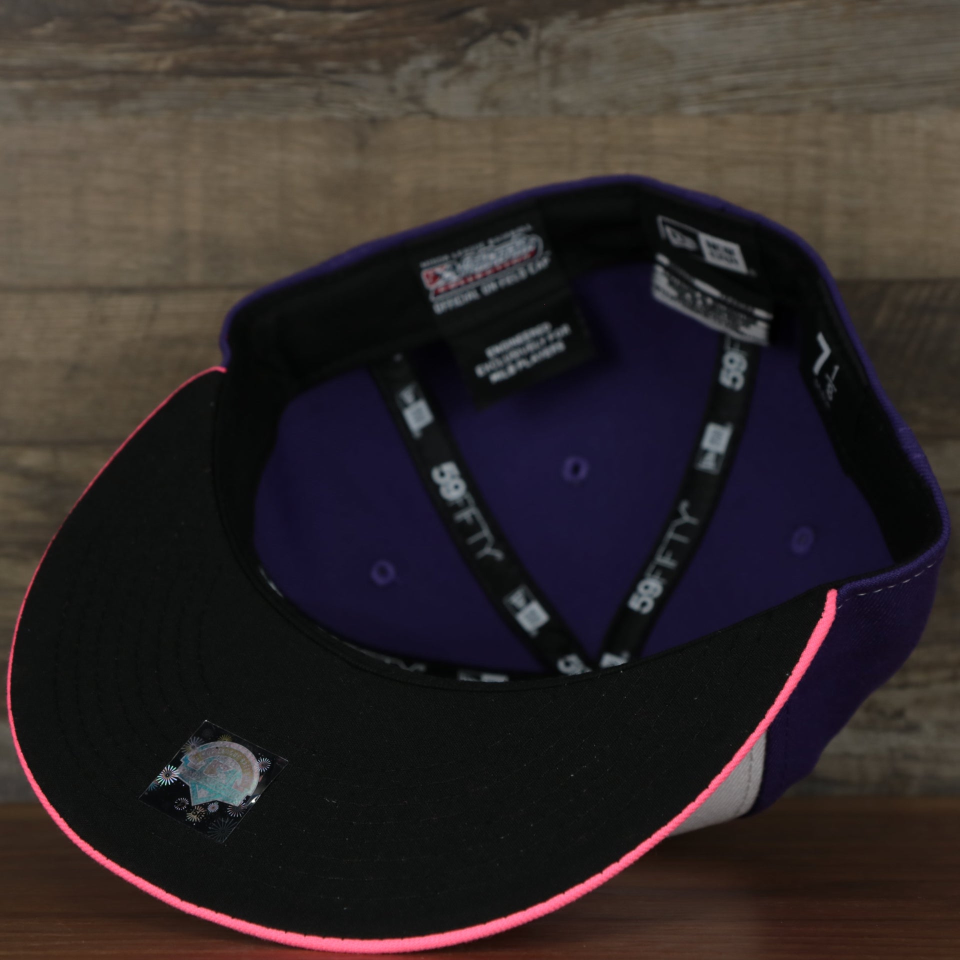 underside of the Jersey Shore Blue Claws 2022 Medusas de Jersey Shore Copa de la Diversion On-Field Black Bottom 5950 Fitted Cap | Purple/White