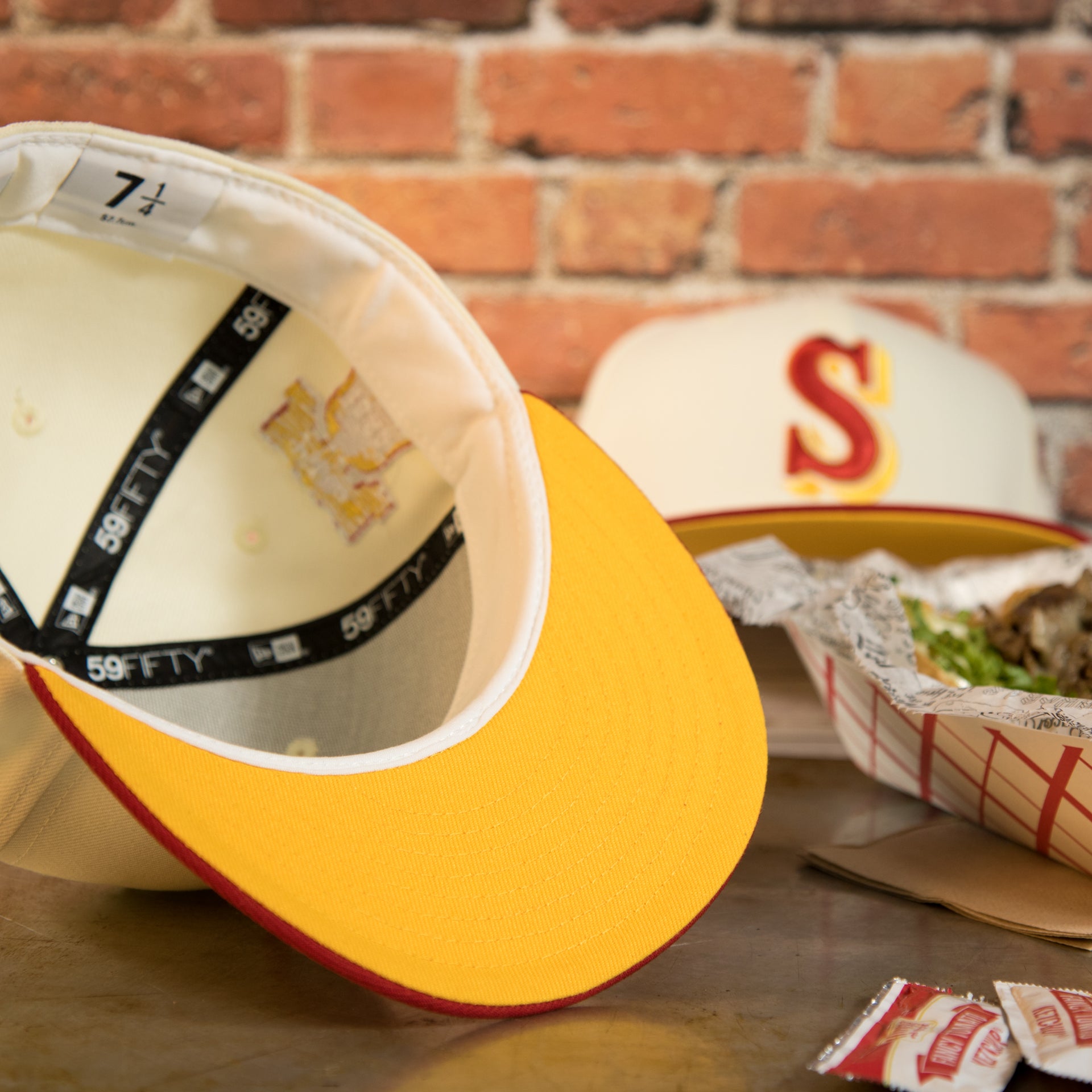 underside of the Seattle Mariners Cooperstown 2007 30th Anniversary Side Patch Yellow UV 59Fifty Fitted Cap | Chrome/Red | CheeseSteak Pack Cap Swag Exclusive