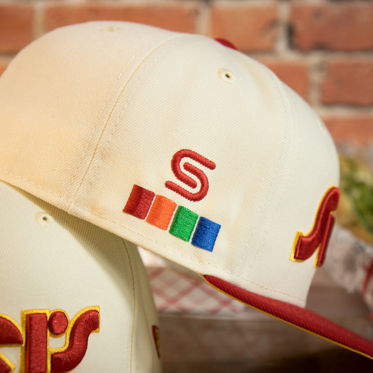 spectrum side patch on the side of the Philadelphia 76ers Retro Spectrum Side Patch Yellow UV 59Fifty Fitted Cap | Chrome/Red | CheeseSteak Pack Cap Swag Exclusive