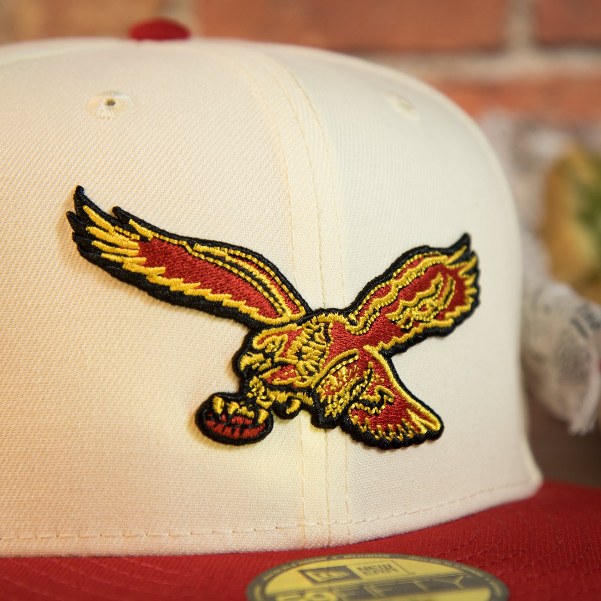 eagles logo on the front of the Philadelphia Eagles Throwback Veterans Stadium Side Patch Yellow UV 59Fifty Fitted Cap | Chrome/Red | CheeseSteak Pack Cap Swag Exclusive