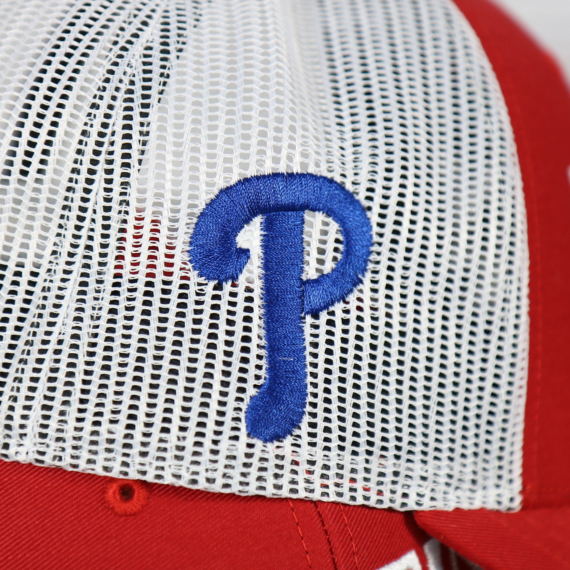 phillies logo on wearer's right on the Philadelphia Phillies 2022 World Series Fightin' Phils Phillies Logo Side Patch Red Adjustable Trucker Snapback Hat