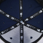 Taping on the interior of the Philadelphia 76ers 2022 City Edition Sixers Script Spectrum Side Patch Navy 59Fifty Fitted Cap