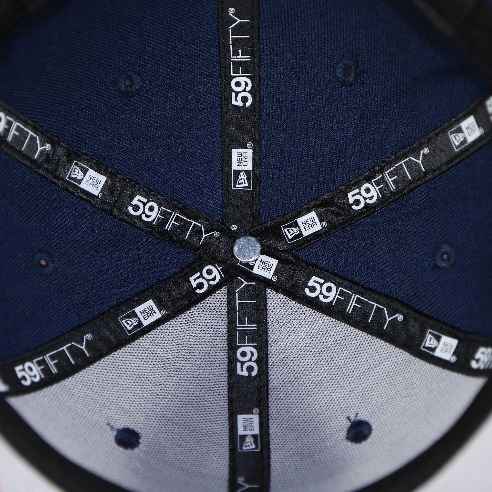 Taping on the interior of the Philadelphia 76ers 2022 City Edition Sixers Script Spectrum Side Patch Navy 59Fifty Fitted Cap