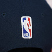 Close up of the NBA logo on the Philadelphia 76ers 2022 City Edition Sixers Script Spectrum Side Patch 9Fifty Snapback Hat