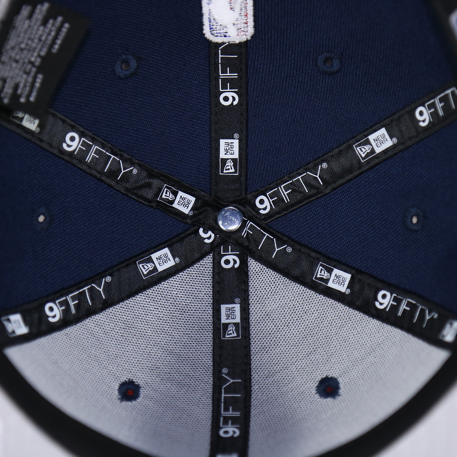 Taping on the Philadelphia 76ers 2022 City Edition Sixers Script Spectrum Side Patch 9Fifty Snapback Hat