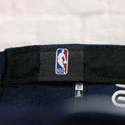 NBA label in the Philadelphia 76ers 2022 City Edition Sixers Script Spectrum Side Patch 9Fifty Snapback Hat