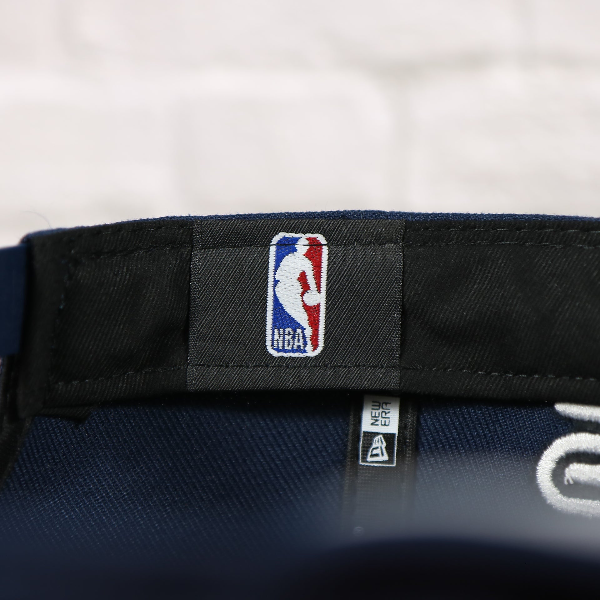 NBA label in the Philadelphia 76ers 2022 City Edition Sixers Script Spectrum Side Patch 9Fifty Snapback Hat