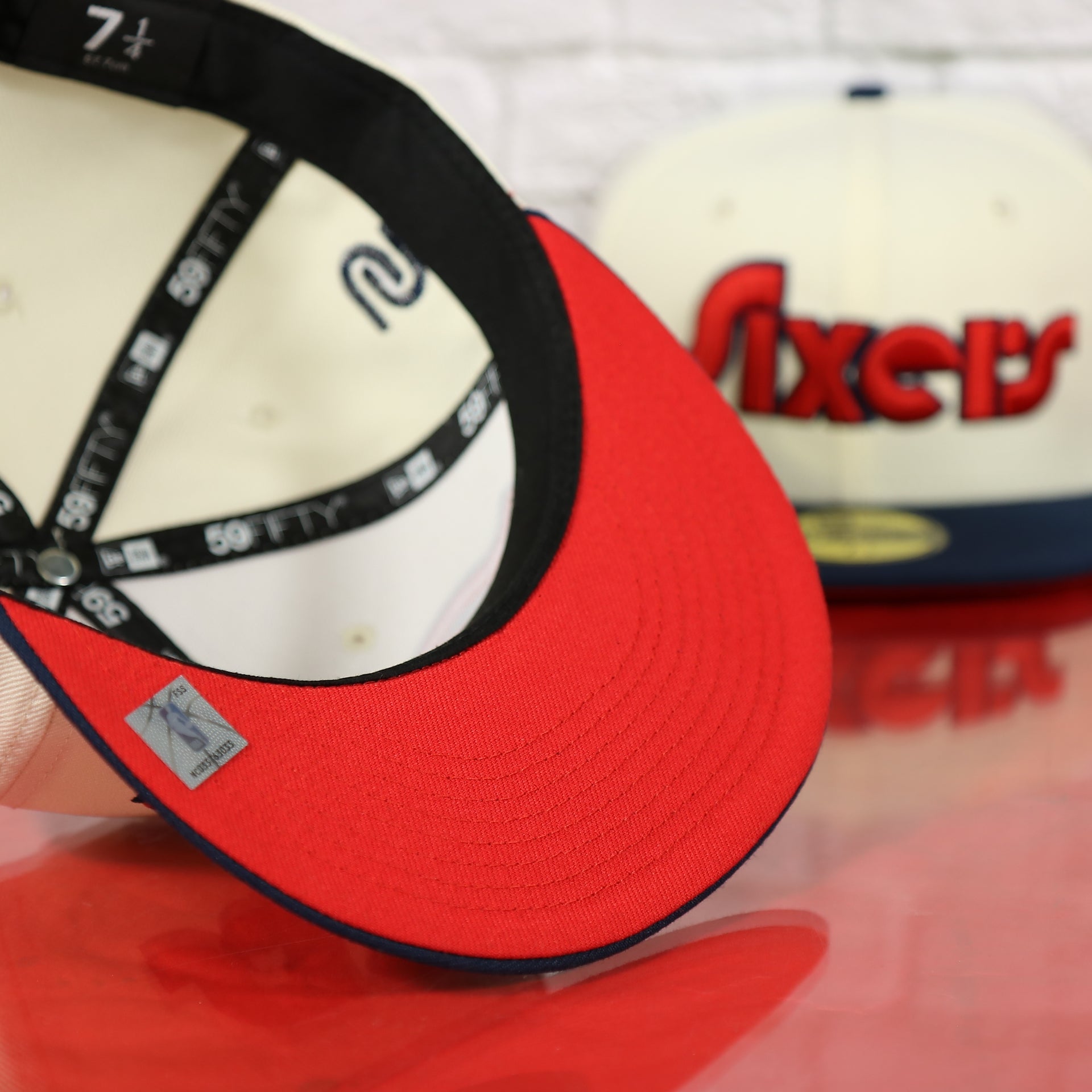 Red undervisor of the Philadelphia 76ers 2022 City Edition Sixers Script Spectrum Side Patch Chrome/Navy 59Fifty Fitted Cap