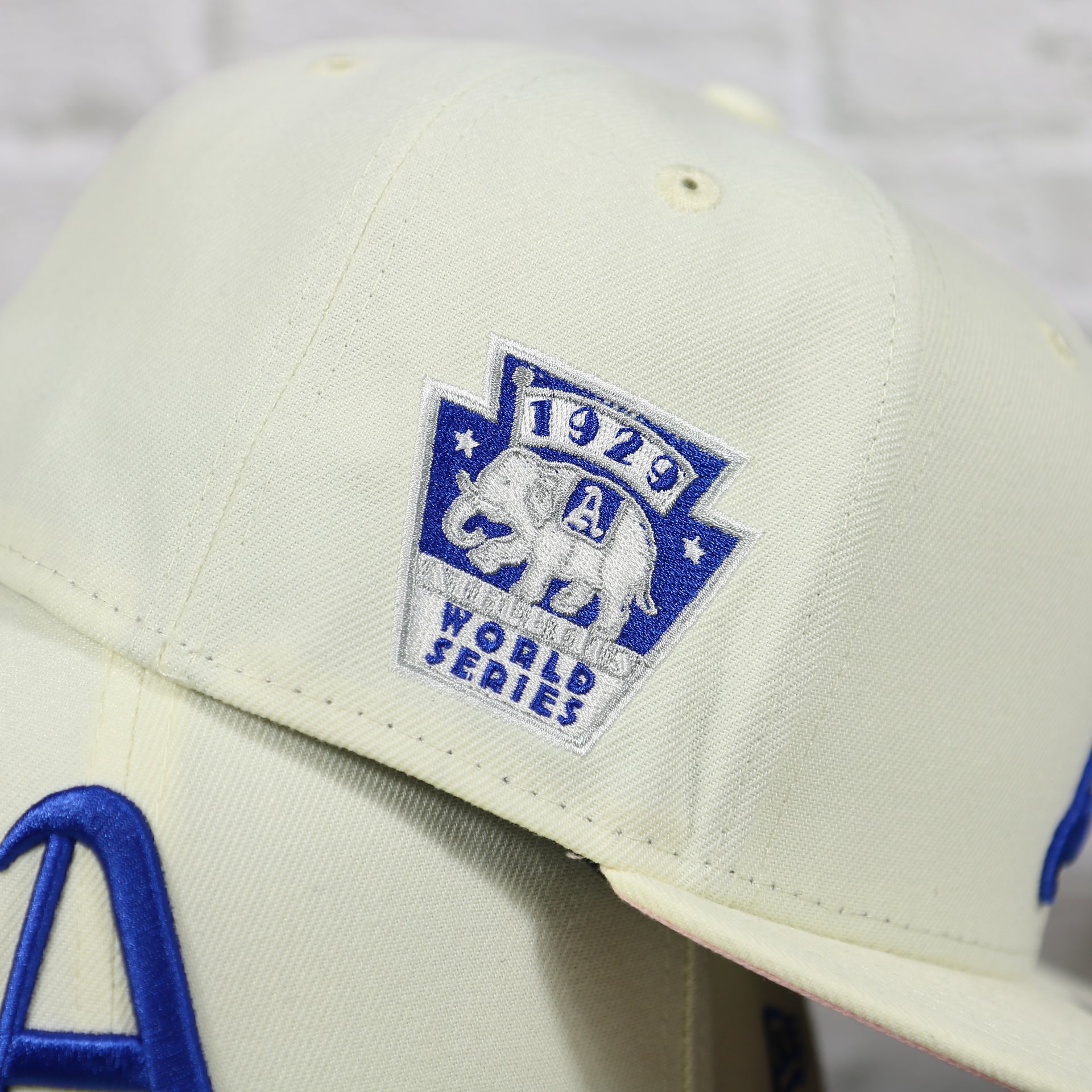 wearers right on the Philadelphia Athletics 1929 World Series Side Patch Pink Bottom Chrome 59Fifty Fitted Cap | "The Athletics Pack"