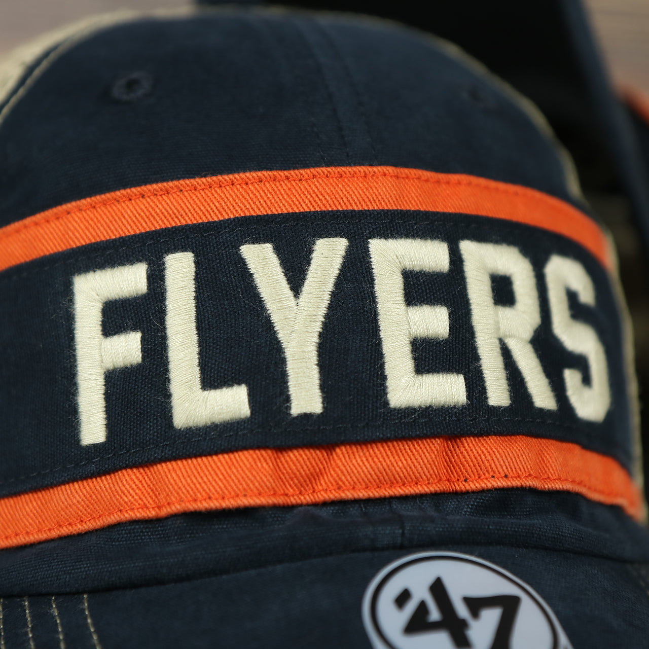 front logo of the Philadelphia Flyers Vintage Meshback Orange/Black Trucker Snapback Hat