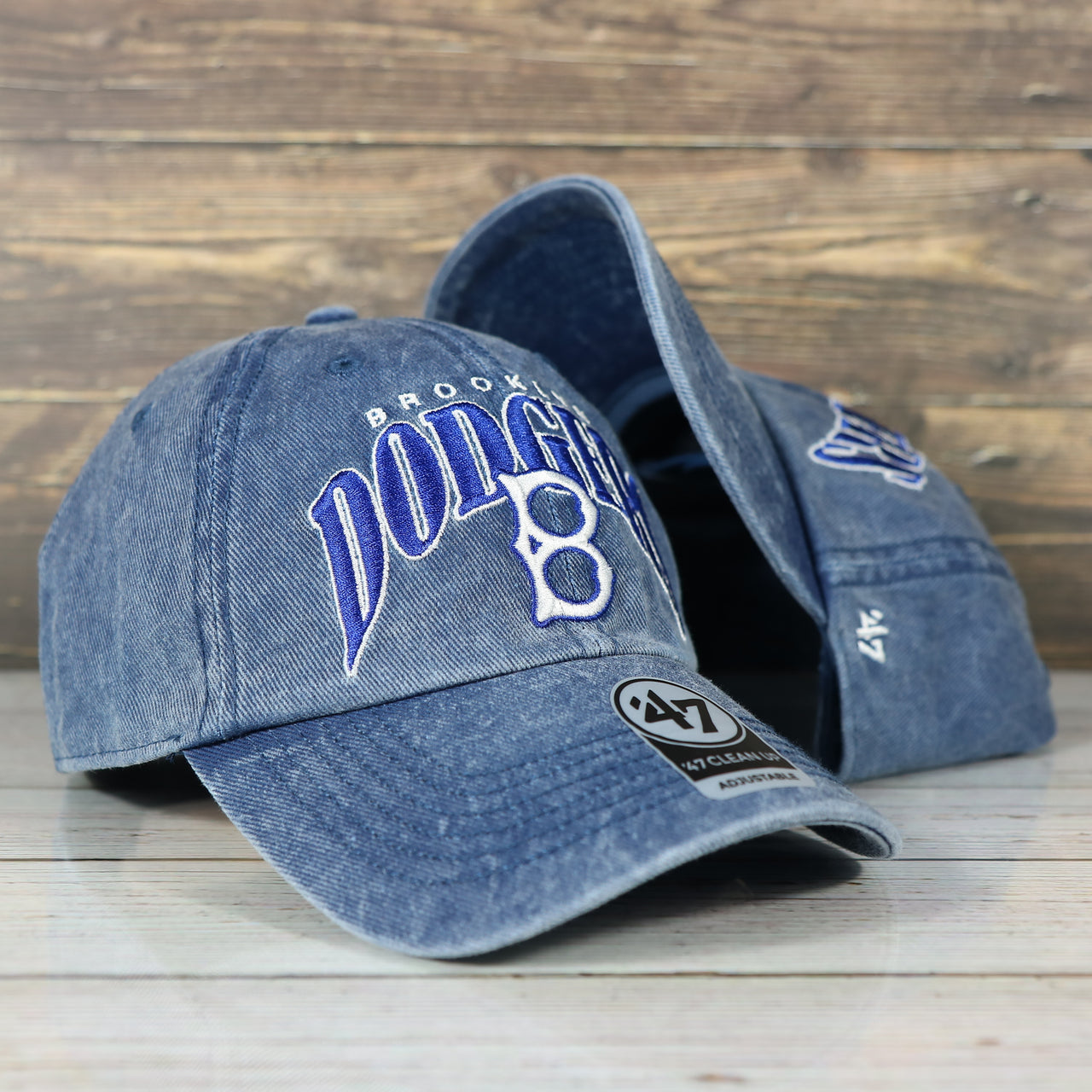 front of the Brooklyn Dodgers Throwback Distressed Blue Dad Hat | Blue Adjustable Baseball Cap