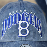 logo on the front of the Brooklyn Dodgers Throwback Distressed Blue Dad Hat | Blue Adjustable Baseball Cap