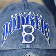 logo on the front of the Brooklyn Dodgers Throwback Distressed Blue Dad Hat | Blue Adjustable Baseball Cap
