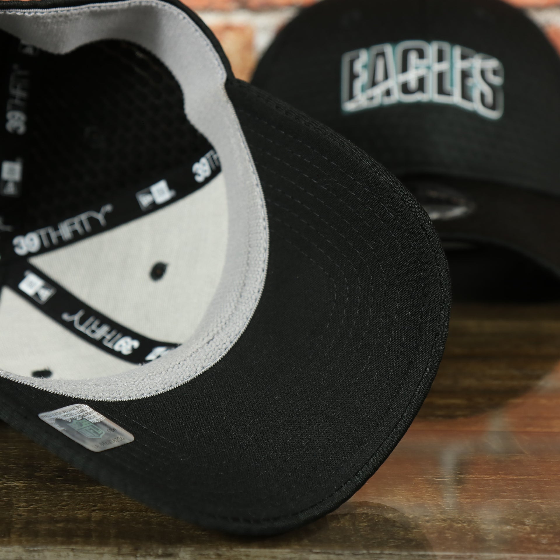 black under visor on the Eagles 2020 Training Camp Flexfit | Philadelphia Eagles 2020 On-Field Black Training Camp Stretch Fit