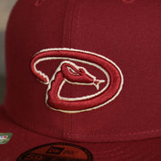 A close up of the Diamondbacks logo on the Arizona Diamondbacks Onfield 2022 Batting Practice 59Fifty Trucker Hat