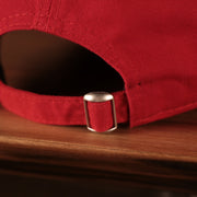 A closeup shot of the adjustable strap at the backside of the Fightin Phils 2021 fourth of July red 920 dad hat.