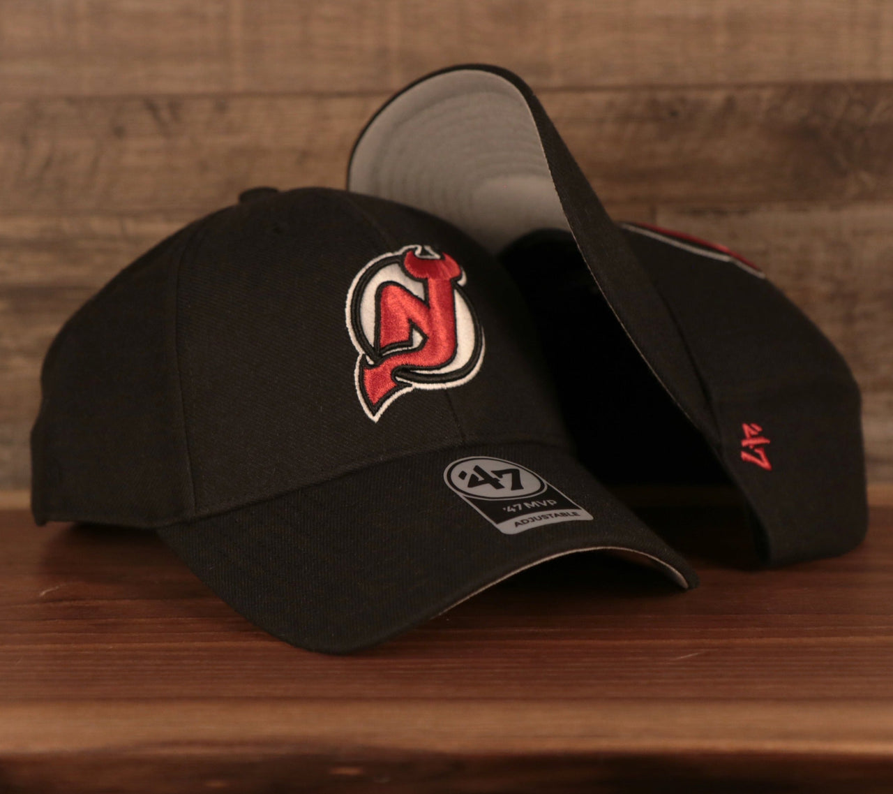 front and bottom of the New Jersey Devils Black Adjustable Dad Hat